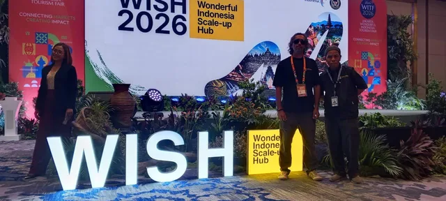 Bros Wisata team members photographed in the stage area with a WISH 2026 backdrop.