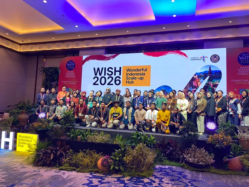 A group photograph on stage with a WISH 2026 backdrop.