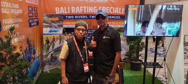 Two Bros Wisata representatives photographed at the Sobek Bali booth during WITF 2026.