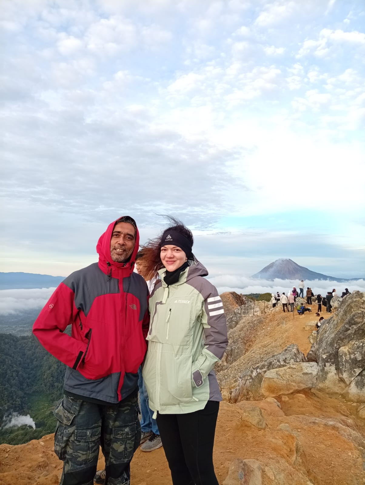Ahmad accompanying an adult guest on a North Sumatra mountain route